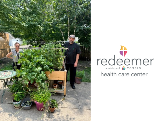 Redeemer Health Care Center's Activities Director, Alyssa, and Cook, Matt, stand by the thriving garden.